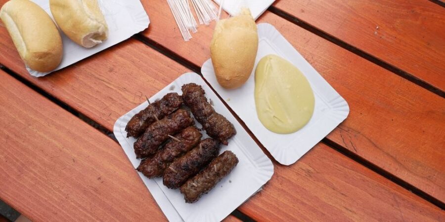 Bucharest: Street Food Tour with a Local Guide - Starting with the snack of communism: pretzel and yogurt
