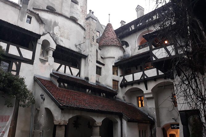 Dracula's Castle & Peles Palace Tour from Bucharest Including Brasov Old Town - Bran Castle: medieval strength on Dracula’s rock